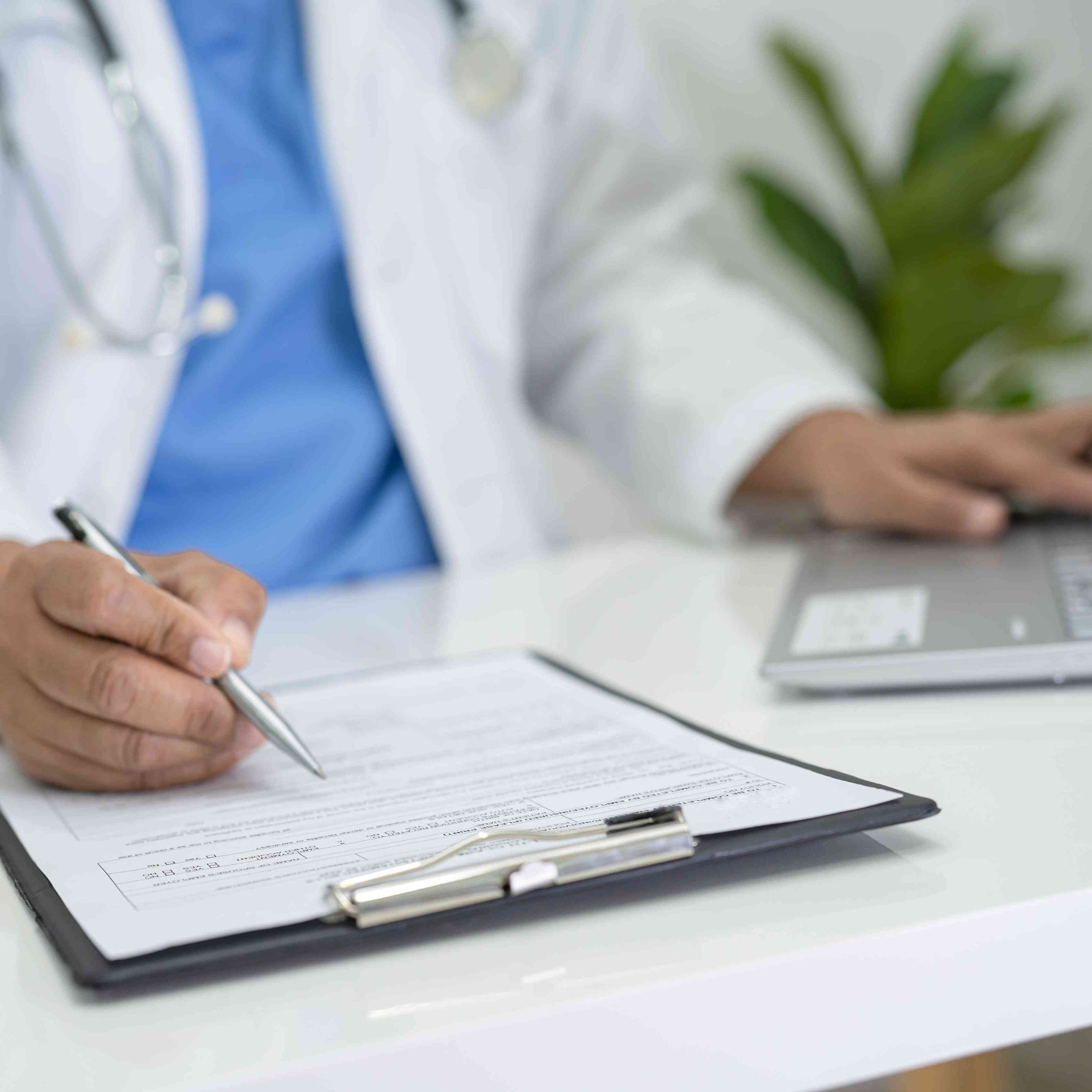 Physician completing paperwork for a Taiwan travel health certificate in Houston, Texas